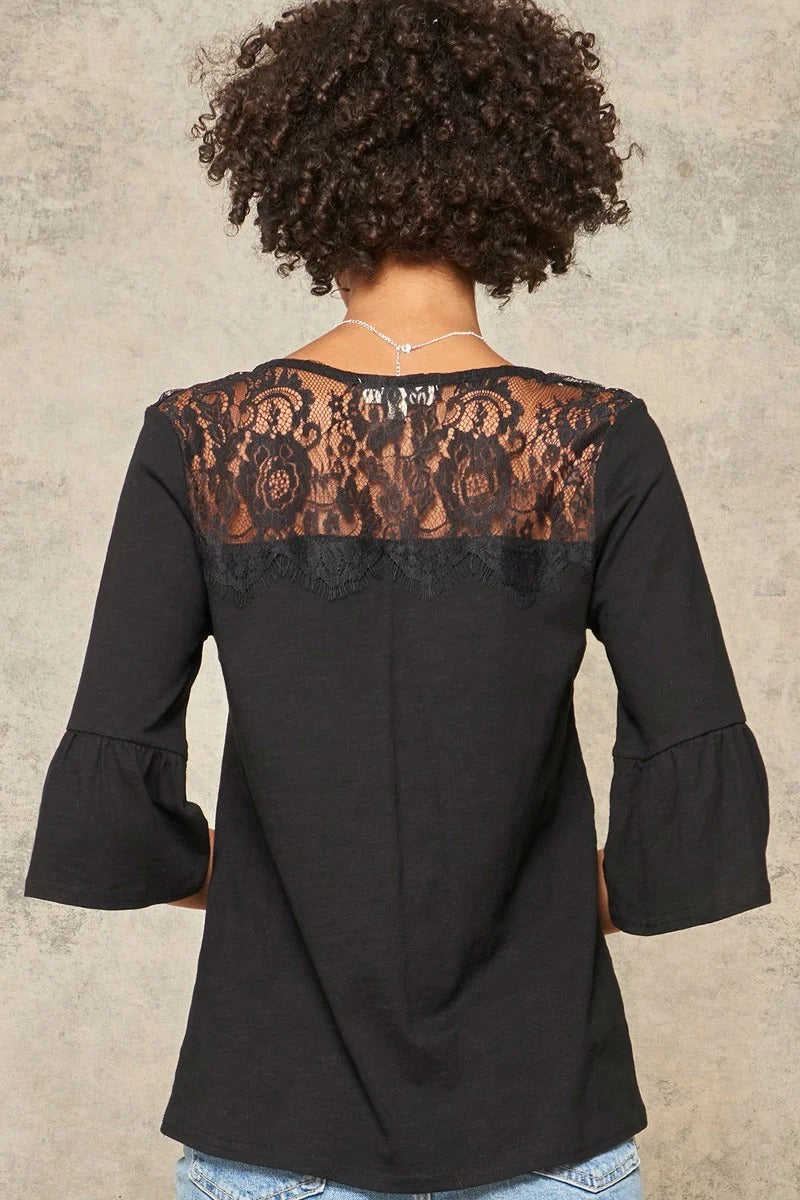 A Knit Top With Deep V Neckline And Yoke Design — Black