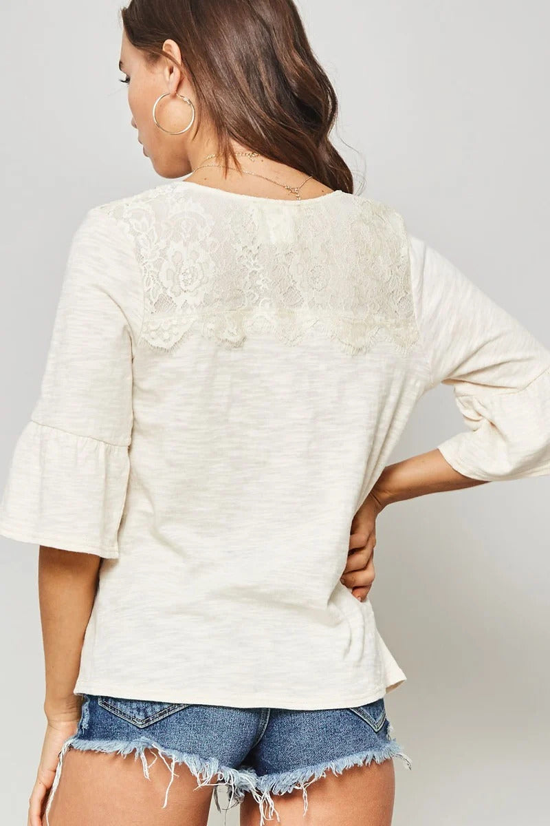 A Knit Top With Deep V Neckline And Yoke Design — Vanilla